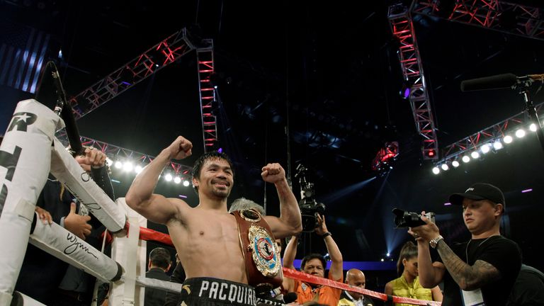 Boxer Manny Pacquiao celebrates after beating Jessie Vargas with a unanimous decision to win the WBO welterweight Championship at the Thomas & Mack Center 