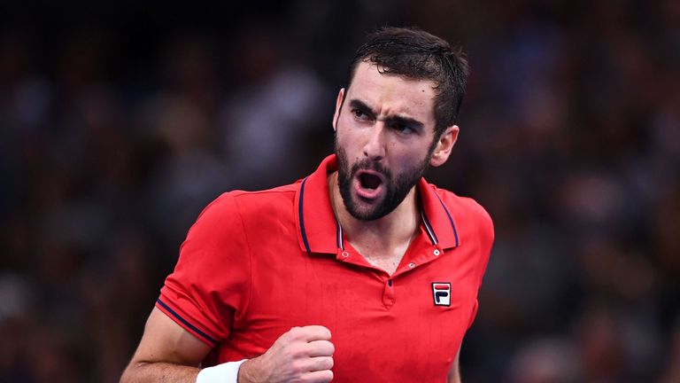 Croatia's Marin Cilic celebrates after scoring during his quarter-final tennis match against Serbia's Novak Djokovic at the ATP World Tour Masters 1000 ind