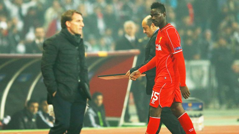 Mario Balotelli glares at Brendan Rodgers after the striker was substituted in a Liverpool match