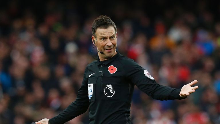 English referee Mark Clattenburg gestures during the English Premier League football match between Arsenal and Tottenham Hotspur at the Emirates Stadium in