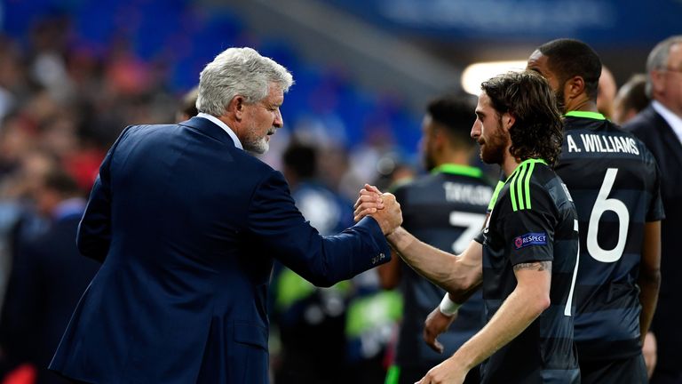 LYON, FRANCE - JULY 06: Mark Hughes and Joe Allen of Wales shake hands after the UEFA EURO 2016 semi final match between Portugal and Wales at Stade des Lu