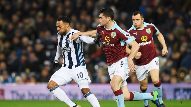 WEST BROMWICH, ENGLAND - NOVEMBER 21:  Matt Phillips of West Bromwich Albion holds off Michael Keane of Burnley during the Premier League match between Wes