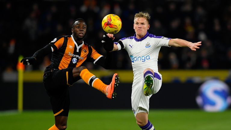 Adama Diomande of Hull City and Matt Ritchie of Newcastle United battle for the ball during the EFL Cup quarter-final