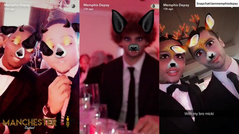 Memphis Depay plays with Snapchat during the United for UNICEF gala dinner at Old Trafford