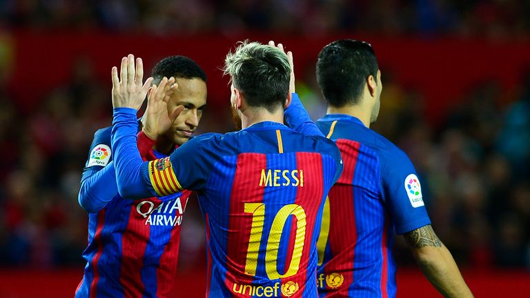 Barcelona's Argentinian forward Lionel Messi (C) celebrates with Barcelona's Brazilian forward Neymar