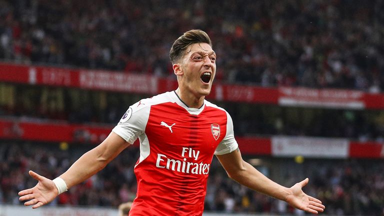 Mesut Ozil celebrates scoring Arsenal's third goal during the match against Chelsea 