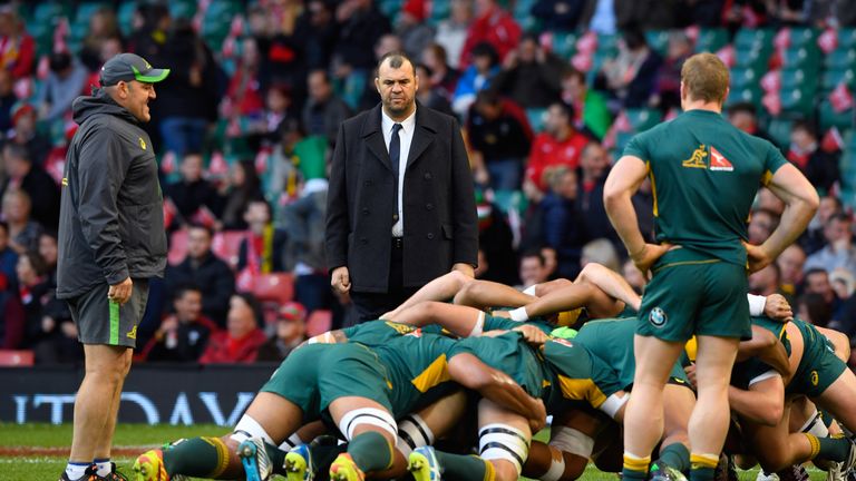 Michael Cheika the head coach of Australia watches his players warm up prior to their game against Wales