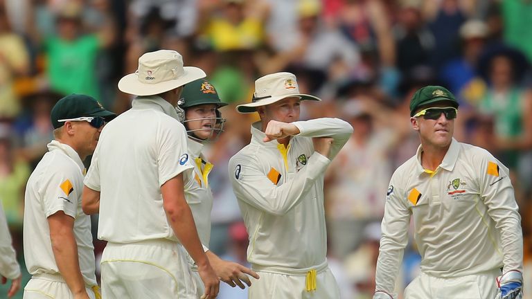 Michael Clarke of Australia signals for the DRS as Matt Prior of England is given out