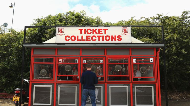 MIDDLESBROUGH, ENGLAND - AUGUST 13: A Middlesbrough fan collects their tickets prior to kick off during the Premier League match between Middlesbrough and 