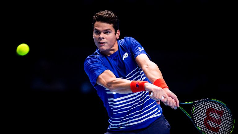 Milos Raonic in action against Novak Djokovic during the World Tour Finals