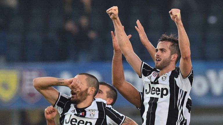 Juventus midfielder Miralem Pjanic (R) celebrates with teammates