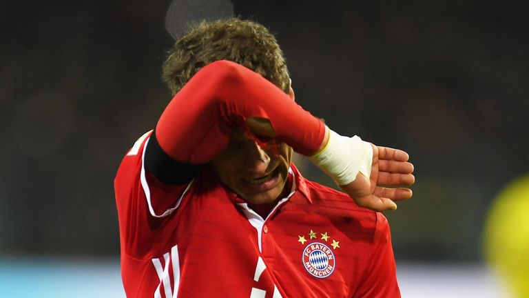 Bayern Munich's midfielder Thomas Mueller reacts after the German first division Bundesliga football match between Borussia Dortmund and FC Bayern Munich i