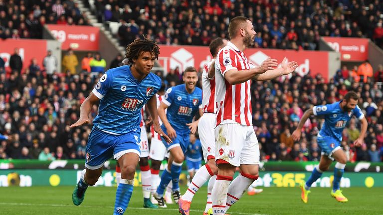 STOKE ON TRENT, ENGLAND - NOVEMBER 19: Nathan Ake of AFC Bournemouth (L) celebrates scoring his sides first goal during the Premier League match between St