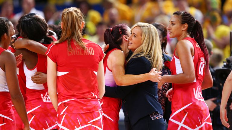 England coach Tracey Neville (C) celebrates with players after victory in  the 2015 Netball World Cup Bronze Medal match
