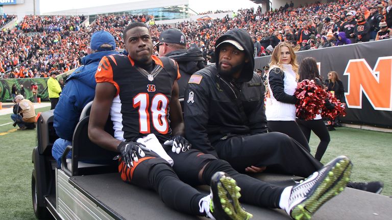 A.J. Green #18 of the Cincinnati Bengals gets carted off of the field after being injured during the first quarter against Buffalo