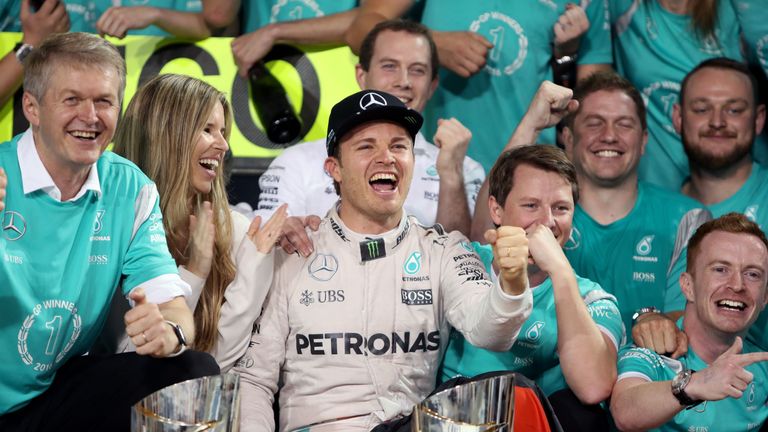 Mercedes' Nico Rosberg celebrates winning the Formula One world championship with with Vivian and the Mercedes team 