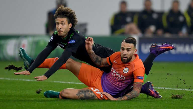 Moenchengladbach's US defender Fabian Johnson and Manchester City's Argentinian defender Nicolas Otamendi vie for the ball during the UEFA group C Champion