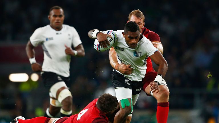LONDON, ENGLAND - SEPTEMBER 18:  Nikola Matawalu of Fiji is hauled down by Geoff Parling and Chris Robshaw of England  during the 2015 Rugby World Cup Pool