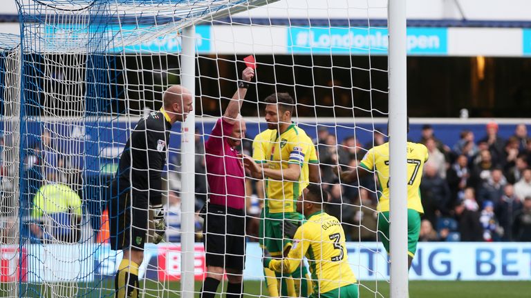 Norwich players react to Martin Olsson's  (No 3) red card against QPR