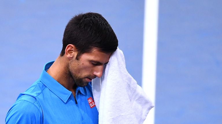Serbia's Novak Djokovic wipes his face with a towel during his quarter-final tennis match against Croatia's Marin Cilic at the ATP World Tour Masters 1000 