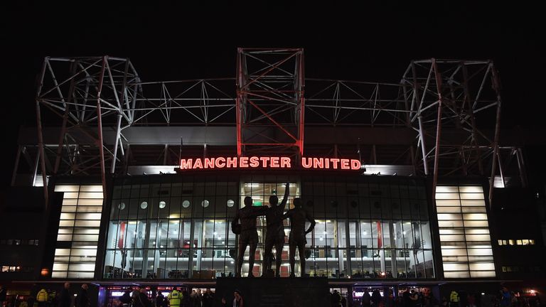 A night time view of Manchester United's Old Trafford stadium 