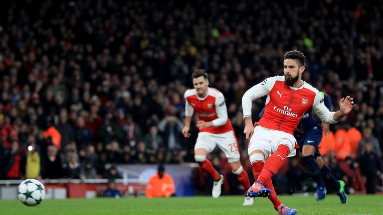 Arsenal's Olivier Giroud scores his side's first goal of the game from the penalty spot during the UEFA Champions League match at the Emirates Stadium, Lon