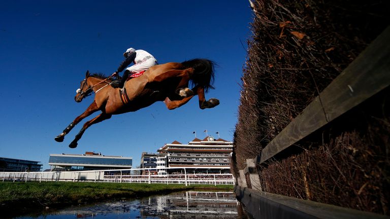 NEWBURY, ENGLAND - NOVEMBER 25: Gavin Sheehan riding One Track Mind clear the water jump during The Fuller's London Pride Novices' Steeple Chase at Newbury