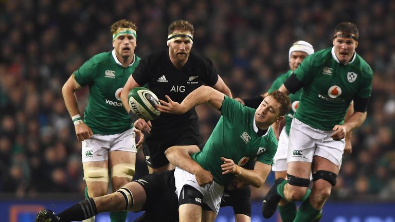 DUBLIN, IRELAND - NOVEMBER 19: Jackon of Ireland (C) is tackled during the International match between Ireland and New Zealand All Blacks at Aviva Stadium 