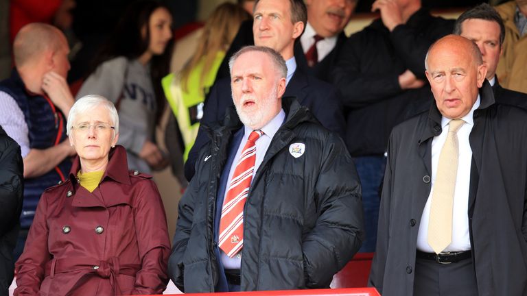 Barnsley owner Patrick Cryne (centre) and chairman Maurice Watkins (right) in the stands 