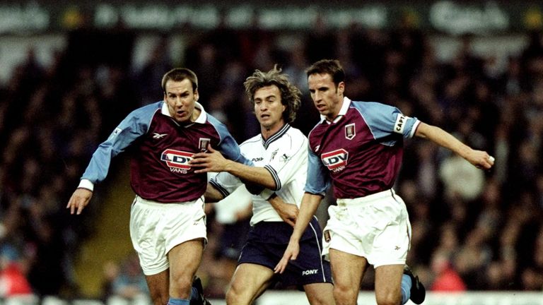 7 Nov 1998:  Aston Villa captain Gareth Southgate brings the ball clear as team mate Paul Merson is held by David Ginola of Tottenham Hotspur during the FA