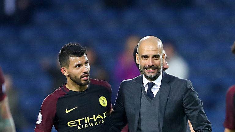 Manchester City manager Pep Guardiola (right) and Manchester City's Sergio Aguero celebrate after the final whistle of the Premier League match at The Hawt