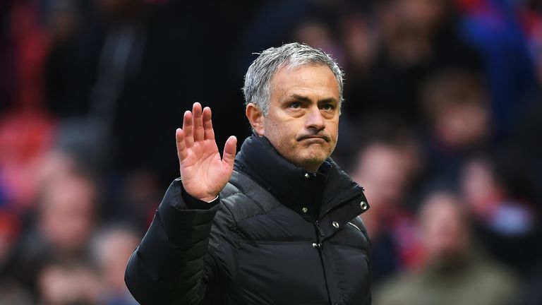Jose Mourinho waves to the Old Trafford crowd at the final whistle
