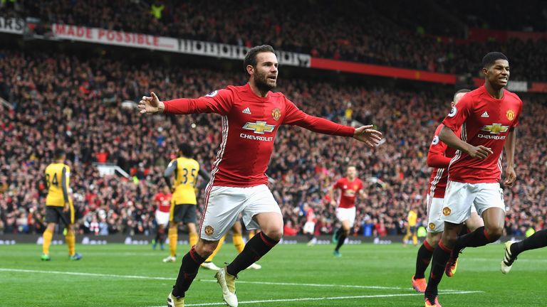 Juan Mata celebrates scoring the opening goal of the game