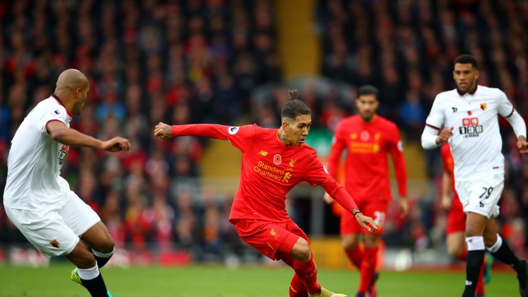 Younes Kaboul closes down Liverpool's Roberto Firmino