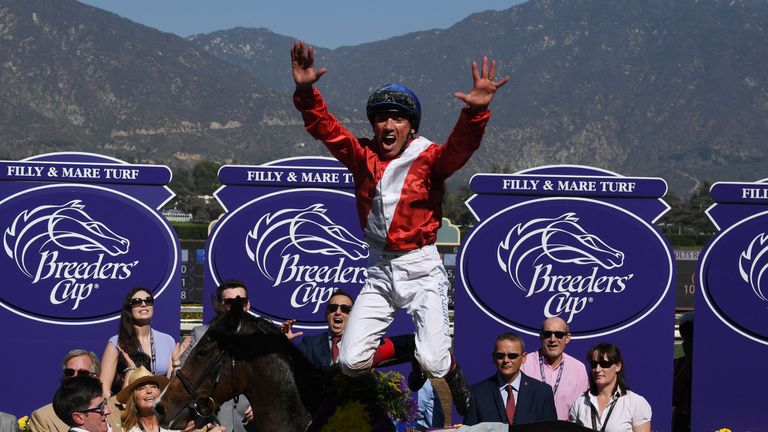 Jockey Lanfranco Dettori celebrates after riding Queen's Trust to win the Breeders' Cup Filly and Mare Turf race during day two of the 2016 Breeders' Cup W