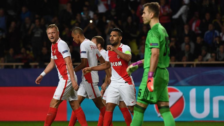 Monaco's Polish defender Kamil Glik (L) and Monaco's Colombian forward Radamel Falcao (C) celebrate after scoring a goal next to CSKA Moscow's goalkeeper I