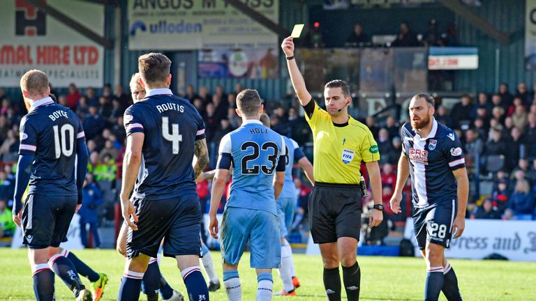 Rangers' Jason Holt is shown a yellow card for simulation during the game against Ross County