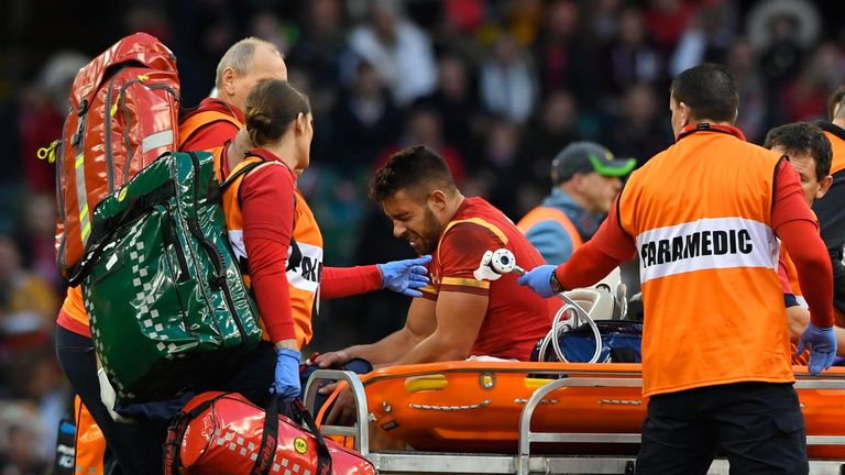 Rhys Webb of Wales is taken from the field with an injury during the international match against Australia