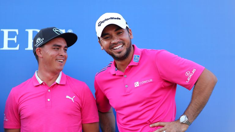 PONTE VEDRA BEACH, FL - MAY 15:  Rickie Fowler (L) of the United States and Jason Day of Australia celebrate after Day won the final round of THE PLAYERS C
