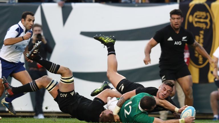 Robbie Henshaw of Ireland crashes over to score his team's fifth try 