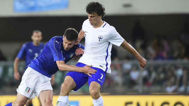 Roman Eremenko (R) in action for Finland against Italy