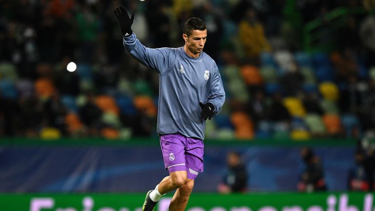 Real Madrid's Portuguese forward Cristiano Ronaldo waves to the crowd as he warms up for the UEFA Champions League football match Sporting CP vs Real Madri