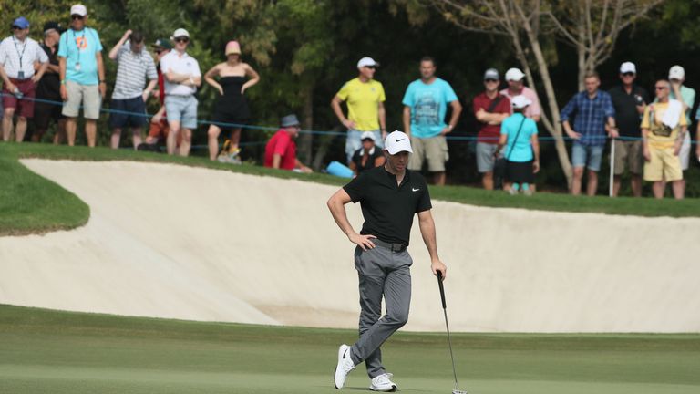 Rory McIlroy of Northern Ireland looks on after playing a shot during the third day of the DP World Tour Championship event at the Jumeirah Golf Estates on