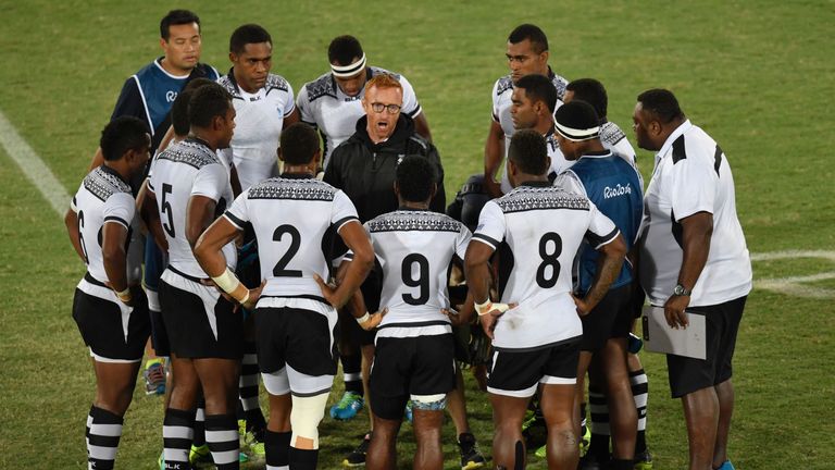 Ben Ryan speaks to the Fiji players during the Olympics gold medal match