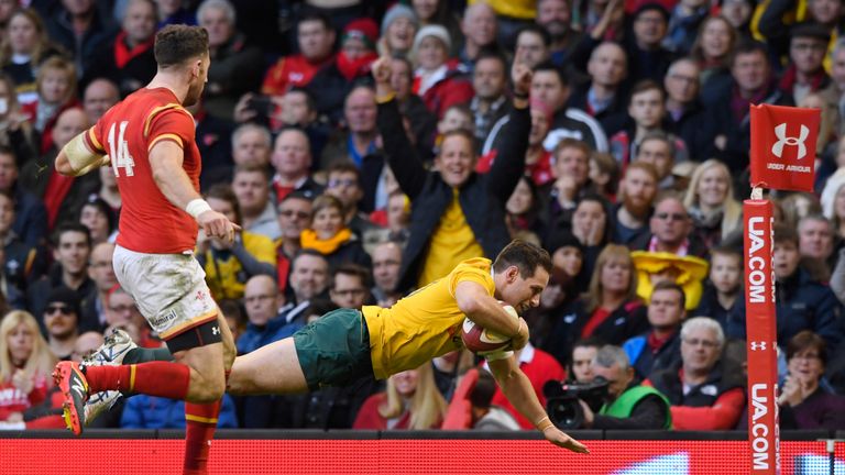 Bernard Foley dives over to score Australia's fourth try against Wales