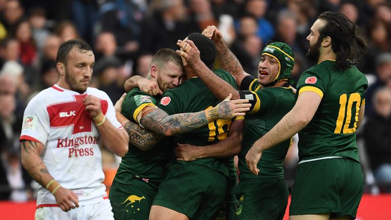 Josh Hodgson is dejected as Austraila celebrate Josh Dugan's try