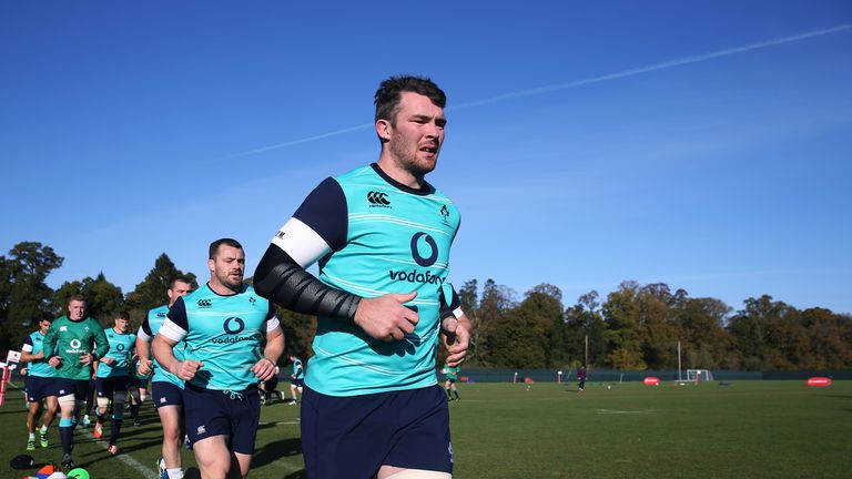 Peter O'Mahony leads the players in a warm up during an Ireland training session