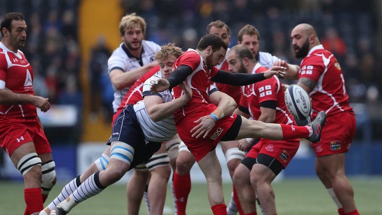 Vasil Lobzhanidze clears downfield against Scotland