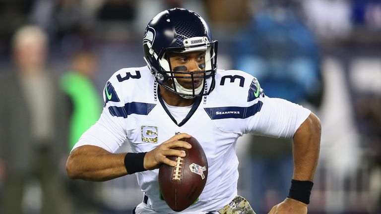 FOXBORO, MA - NOVEMBER 13:  Russell Wilson #3 of the Seattle Seahawks looks to throw the ball during the first quarter of a game against the New England Pa