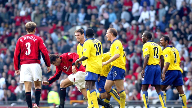 Martin Keown and Ray Parlour taunt Ruud van Nistelrooy following his penalty miss in 2003